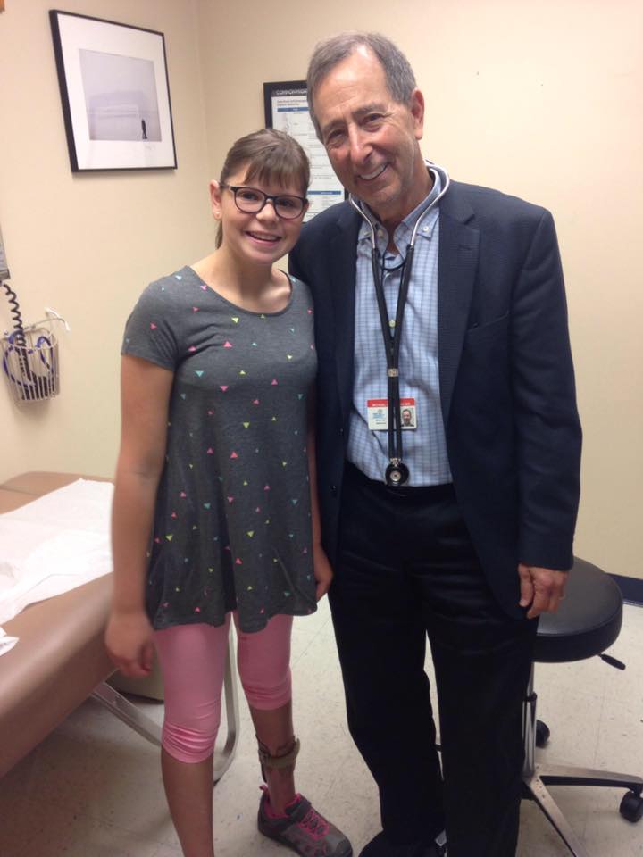 Hannah with Dr. Michael Duchowny during one of her visits.