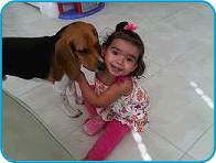 Leila playing with a dog.