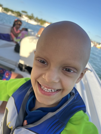 Santiago smiling on boat