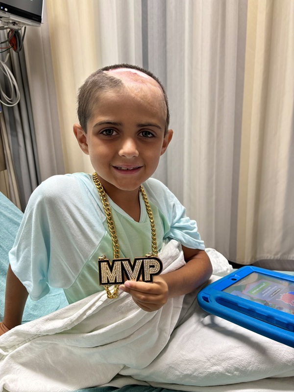 Patient Rydon holding MVP chain