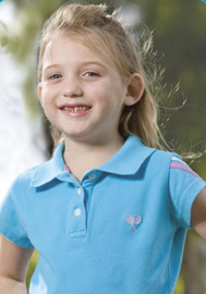 Alexa smiling for the camera while wearing a blue shirt.