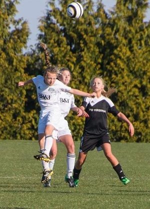 Avery playing soccer