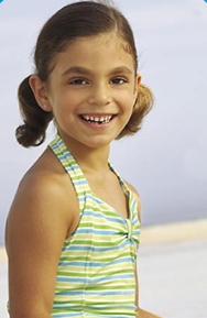 a smiling hannah at the beach