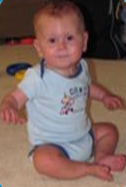 Jonas sitting up as a baby