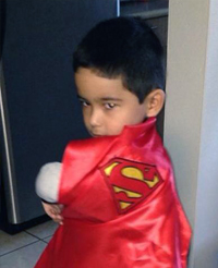 Mauricio wearing a superman cape.