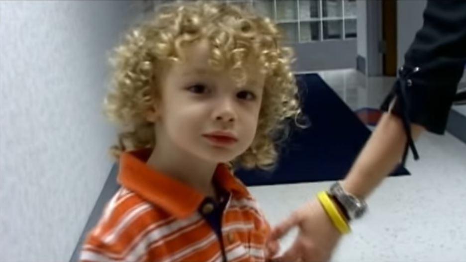 Patrick wearing a orange and white shirt.