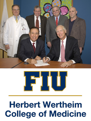 leaders from FIU and the hospital signing their affiliation.