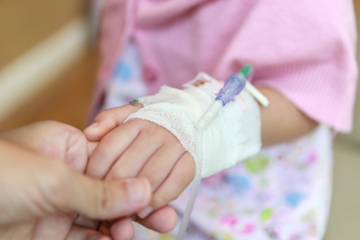 hand of small child with IV port.