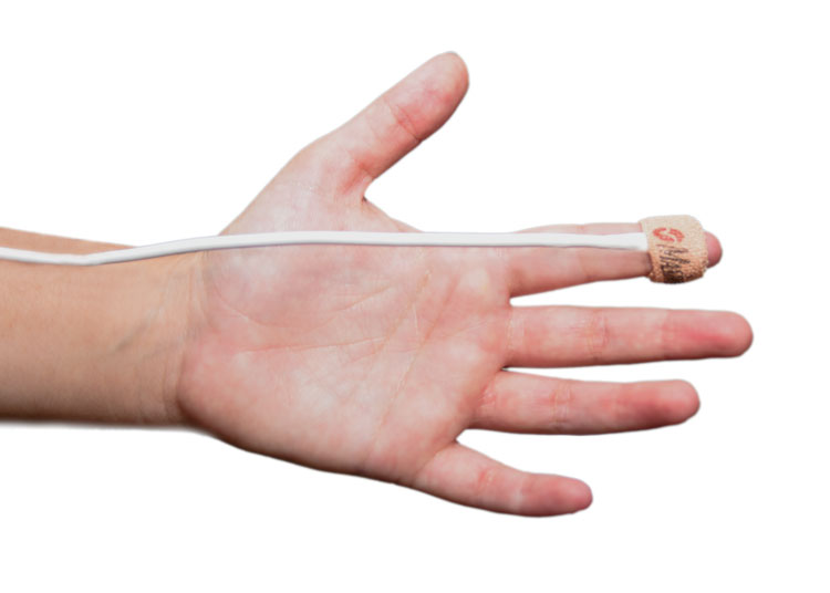 child's hand with pulse oximeter.