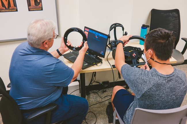 Driving instructor teaching student how to drive