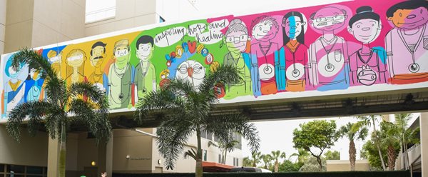 Mural with drawings of physicians, nurses and staff. 