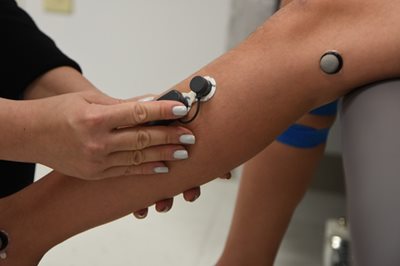 EMG sensors being applied to leg.