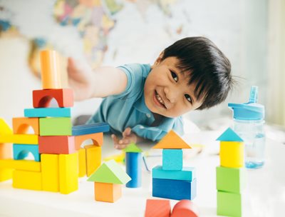 Child playing with building blocks