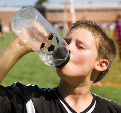 sweaty boy drinking water