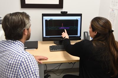 gait lab team looking at computer.