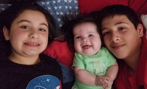 Adrian with siblings