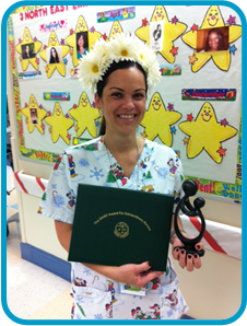 awardee wearing a headband of daisies, daisy award statue, and certificate.