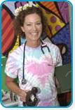 awardee wearing a headband of daisies, daisy award statue, and certificate.