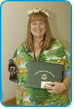 awardee wearing a headband of daisies, daisy award statue, and certificate.