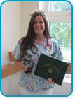 awardee wearing a headband of daisies, daisy award statue, and certificate.