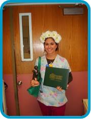 awardee wearing a headband of daisies, daisy award statue, and certificate.