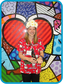 awardee wearing a headband of daisies, daisy award statue, and certificate.